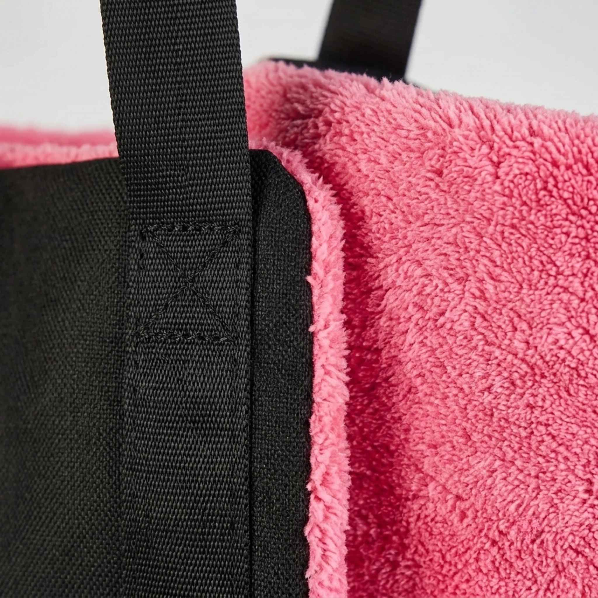 Close detail of the rear lift harness padded handles and stitching